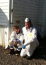 Greencraft :: James volunteering with son Jack with the Warren Wilson College INSULATE! Program to weatherize a local families residence.